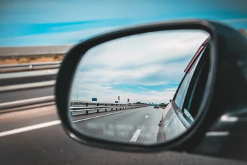 look in the rear view mirror of a car © evgenius1985