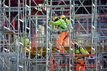 Construction workers working on scaffolding