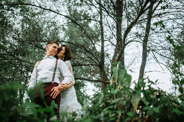 stylish bride and groom in the garden. rustic style