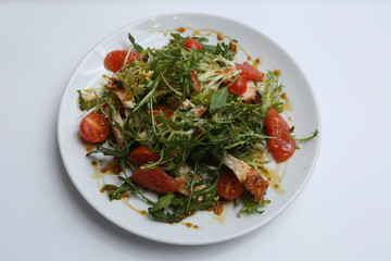 restaurant dish, green salad, cucumbers, red pepper, boiled meat, arugula, tomato and grapefruit, healthy food, close-up, for the menu