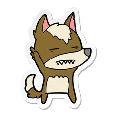 sticker of a cartoon wolf waving showing teeth