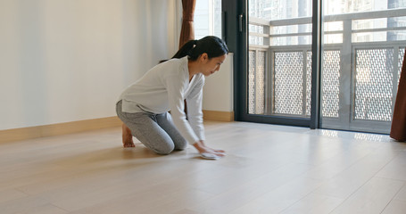 Fototapeta na wymiar Asian Woman clean the floor at home prepare for lunar new year