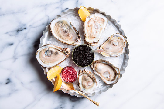 oysters on the half shell with a side of caviar