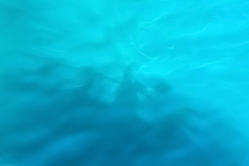 Reflection of shadows on blue water with waves, background