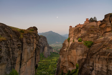 Fototapeta na wymiar Great Meteoron Monastery. Beautiful scenic view, ancient traditional greek building on the top of huge stone pillar in Meteora, Eastern Orthodox Church, Pindos, Thessaly, Greece, Europe.