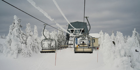 Fototapeta premium Ski lifts in a ski resort, Sun Peaks Resort, Sun Peaks, British Columbia, Canada