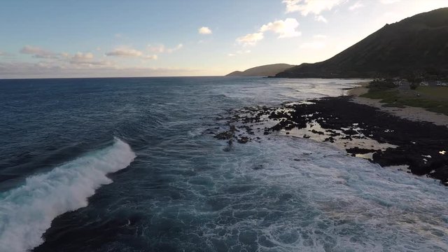 Drone flies up the coast line near Sandy Beach on Oahu, Hawaii.