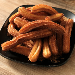 Cooking Churos Sugar. Photo of eating sweet donuts
