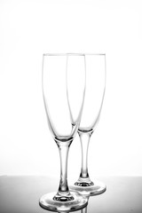 empty glasses for wine and champagne on a white background vertical