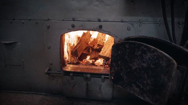 Coffee Roasting Process - Probat coffee roasting machine furnace being filled.