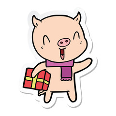 sticker of a happy cartoon pig with xmas present