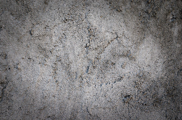 Background of gray casually superimposed concrete.