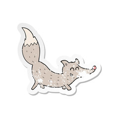 retro distressed sticker of a cartoon little wolf