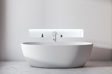 Minimalistic white bathroom with tub and shelf