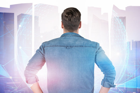 Rear view of man looking at planet interface