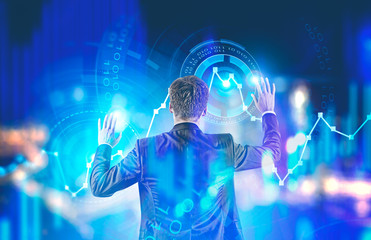 Young caucasian businessman working with graph
