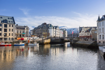 Fototapeta na wymiar Architecture of Alesund town reflected in the water, Norway