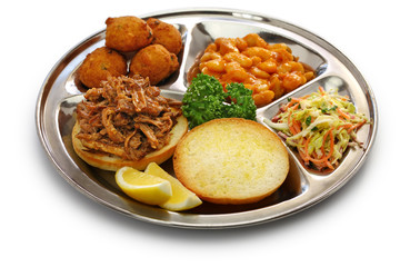 North Carolina barbecue ; pulled pork, hush puppies, baked beans and coleslaw