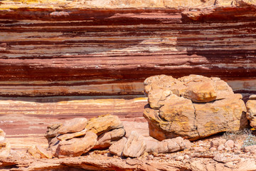 Different colored layers of sediment rock at the coast of Kalbarri National Park