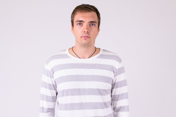 Obraz premium Portrait of man looking at camera against white background