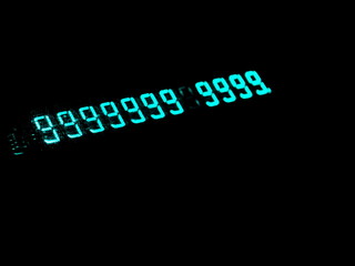 Old numeric display. Glowing numbers. A lot of nines. A lot of bright nines.