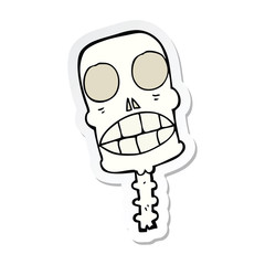 sticker of a cartoon spooky skull