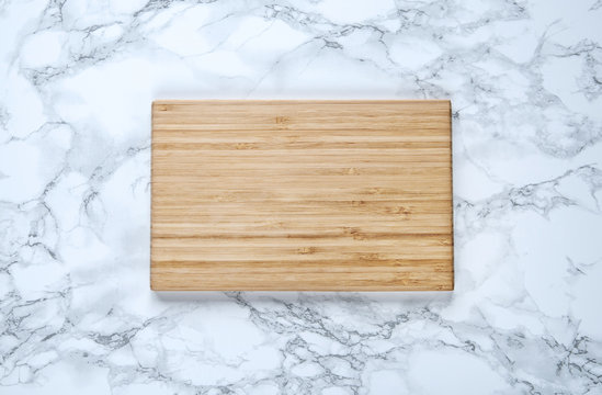 Empty Vintage Cutting Board On A Marble Background.