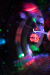 Fototapeta na wymiar RGB Licht Spektrum der Farben umhüllt von einer Frau