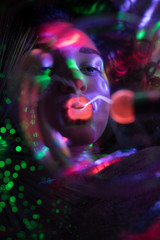 Fototapeta na wymiar RGB Licht Spektrum der Farben umhüllt von einer Frau