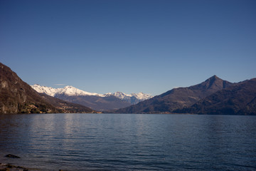 Fototapeta na wymiar Italy, Menaggio, Lake Como, Lake Wakatipu, a large body of water with Lake Wakatipu in the background