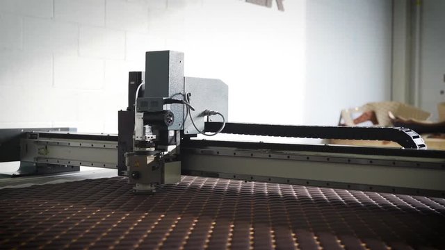 Cutting machine in a manufacturing plant.