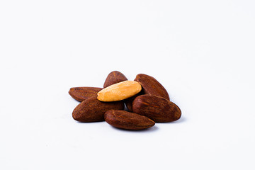Peeled almonds on white background.