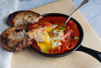 shakshuka baked eggs in tomatoes
