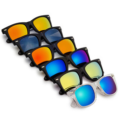 Sunglasses with colorful lenses on white background