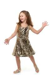 A cheerful little girl is dancing.