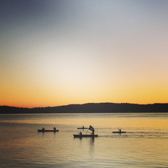 Naklejka na ściany i meble Silhouetted Canoes at Sunset on Puget Sound, WA