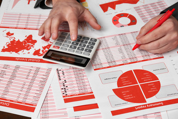 Businessman accountant using calculator for calculating finance on desk office. Business financial...