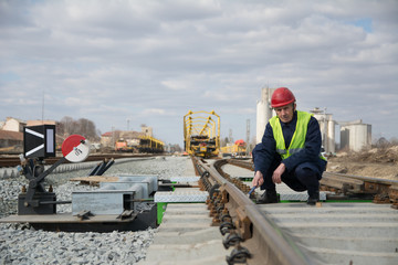 Railroad worker working on the train truck