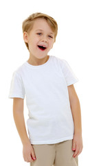 Fototapeta premium A little boy in a pure white t-shirt laughs. Emotions.
