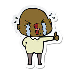 sticker of a cartoon crying bald man