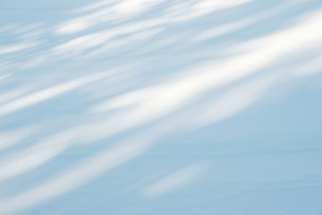 snow texture with sunlight and shadows