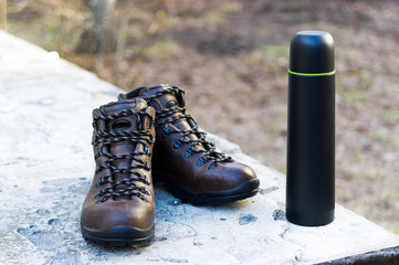 Boots for tourism and thermos. Things tourist and hunter.
