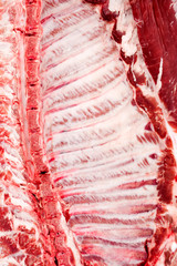 Detail of ribcage of a freshly slaughtered pig. Background.