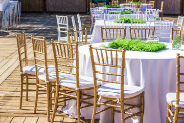 wedding bright pastel and white terrace exterior outdoor environment from dinner banquet event design concept photography  with furniture and dishes