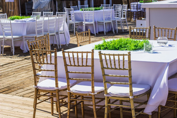 wedding bright pastel and white terrace exterior outdoor environment from dinner banquet event design concept photography  with furniture and dishes