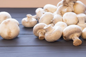 Closeup mushrooms champignon on the table