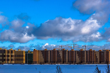 Fototapeta na wymiar multi-storey residential buildings in the big city. Winter cityscape St. Petersburg district Murino