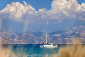 Boat at Paros island with beautiful view to Naxos island, Greece.