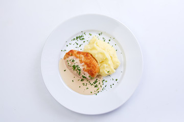 cutlet with mashed potato on the white background