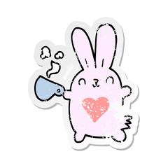 distressed sticker of a cute cartoon rabbit with love heart and coffee cup